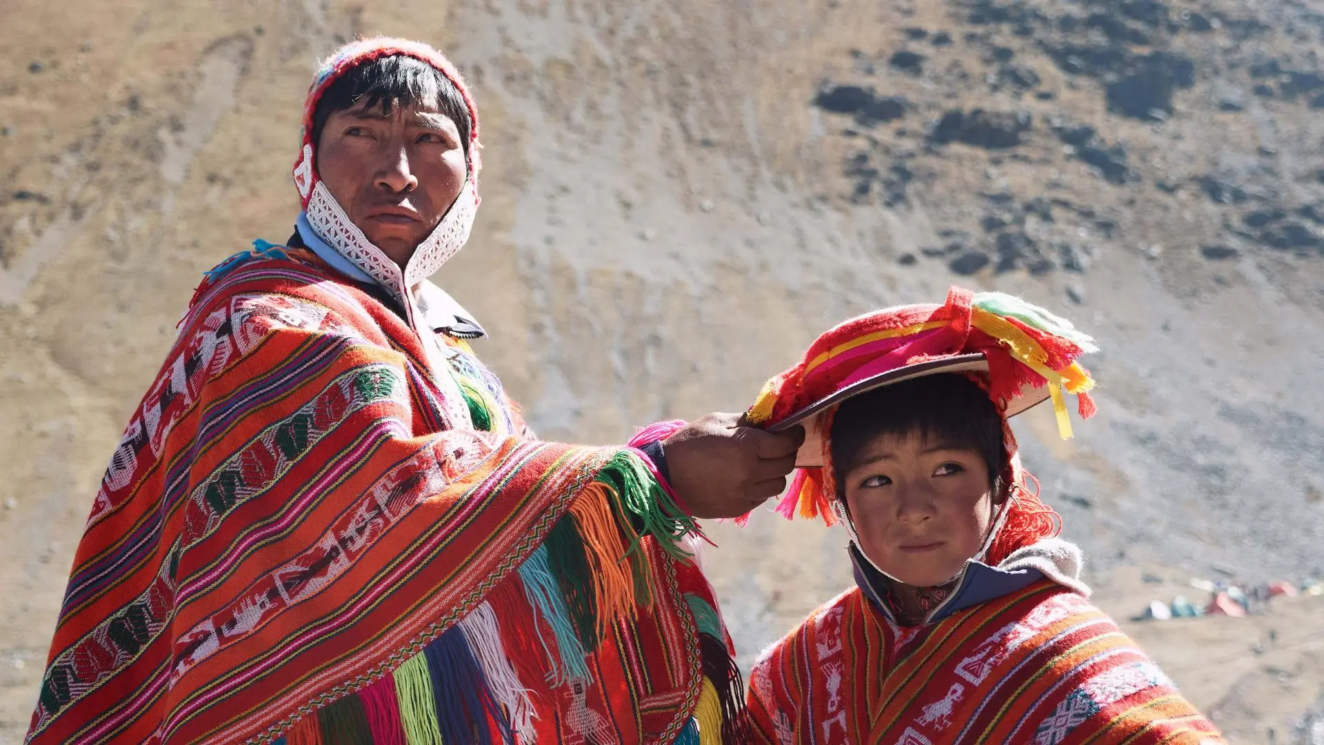 Man and boy wearing traditional Peruvian clothes