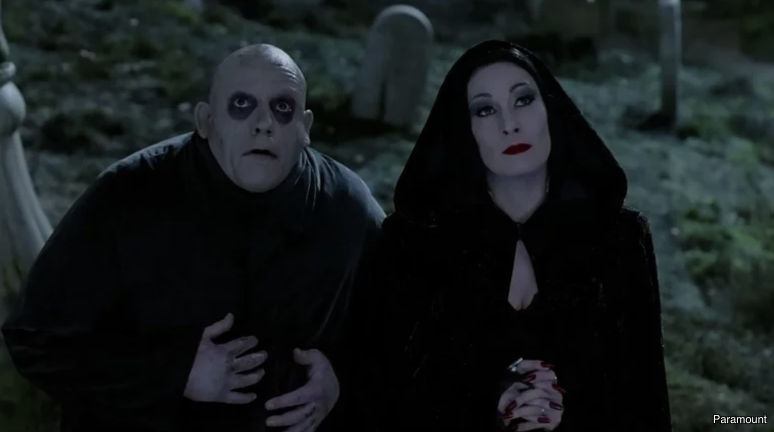 Morticia and Uncle Fester in Addams Family Values; Paramount image credit in lower right-hand corner